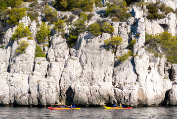 Two kayaks in front of the steep cliffs in the Calanques of Cassis - Provence, France