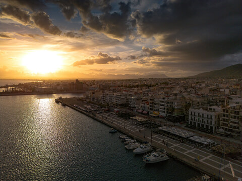 Aerial iconic sunset view over the port of Kalamata seaside city in Messenia, Greece