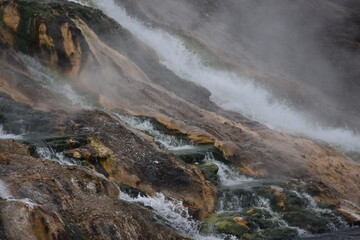 Water droplets, waterfalls, Hot pool, steam, geysers, animal tracks  in snow winter 