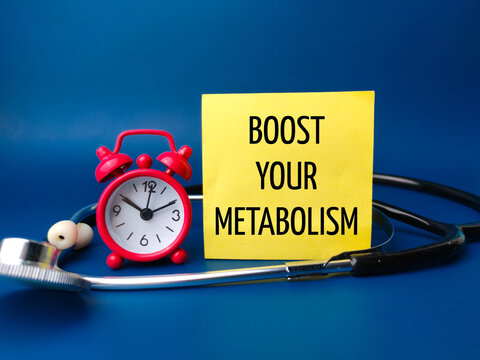 Alarm clock and stethoscope with the word BOOST YOUR METABOLISM