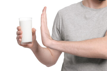 Man with glass of milk suffering from lactose intolerance on white background, closeup