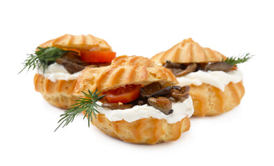Delicious profiteroles with cream cheese, mushrooms, tomato and dill isolated on white