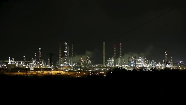 Petrochemical petroleum processing plant at night, Tarragona Spain