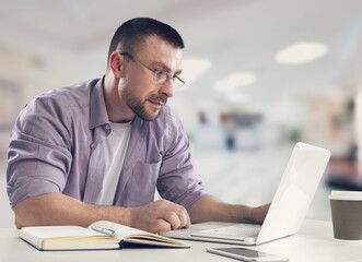 Fototapeta na wymiar young business male working on computer