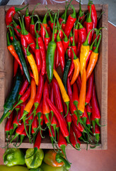 Fresh ripe red, orange, yellow hot chili paprika pepper close up