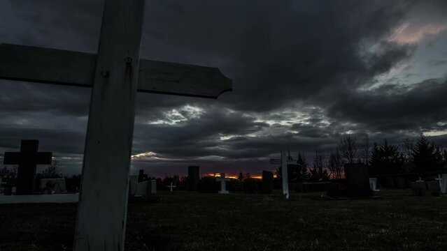 Cemetery cross sliding shot time lapse, evil dark clouds, Halloween