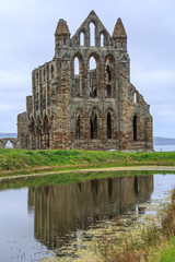 England, North Yorkshire, Whitby. North Sea, East cliff. English Heritage site, ruins of Benedictine abbey, Whitby Abbey, monastery. Inspiration for Bram Stoker's gothic tale Dracula.