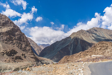 beautiful photo of the road going through the mountains and blue sky at Turtuk village, Nubra Valley, Ladakh, India.