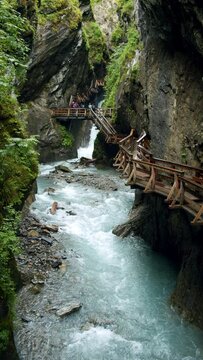 Beautiful Sigmund Thun Klamm gorge with wooden hiking path in Austria.