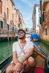 Fototapeta na wymiar tourist on a gondola in venice italy
