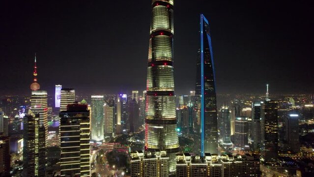 The drone aerial footage of Lujiazui financial and trade zone at night, Pudong, Shanghai, China. Lujiazui is the largest financial zone in mainland China.
