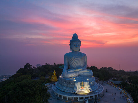 .aerial view Phuket big Buddha in beautiful sunset..aerial photography scenery light through sky in sunset at Phuket big Buddha. .Phuket Big Buddha is one of the island most important and revered 