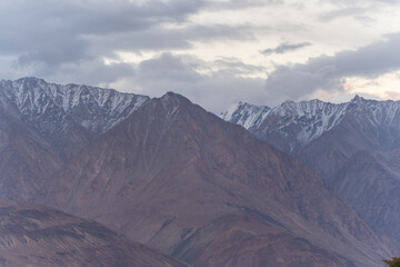 scenery of majestic mountains and cloudy sky at ladkah, India