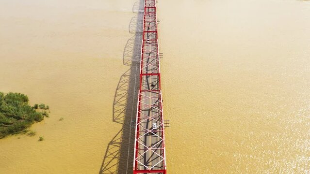 Cagayan River, largest by volume and longest river in the Philippines. The long bridge over the river. Cars ride on the bridge, top view.