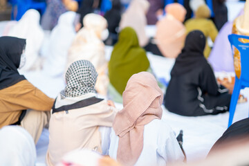 Many Muslims, children, women, and men pray and celebrate Eid al-Fitr which marks the end of the month of Ramadan, they are happy, in Thailand.