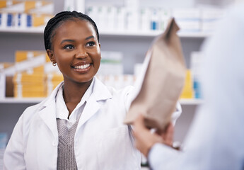 Black woman, medicine or pharmacist hands customer a bag in drugstore with healthcare prescription...