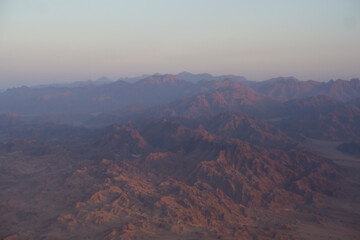 Fototapeta na wymiar Aerial view from window plane of mountains in Egypt.