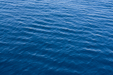 Background shot of aqua sea water surface. Red sea. Blue ocean water texture background. Surface of...