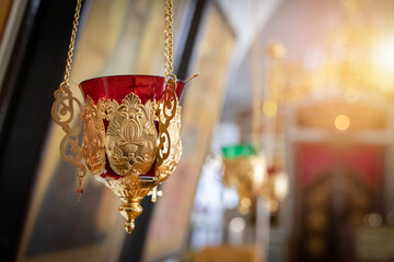 Pendant oil lamp in the orthodox church. Religious paraphernalia. Orthodox Church. Oil lamp close...