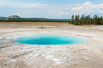 Blue hot spring hole, Midway geyser basin, Yellowstone national park, Wyoming, USA.