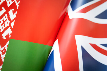 Flags Great Britain and belarus. concept of international relations between countries. The state of governments. Friendship of peoples.