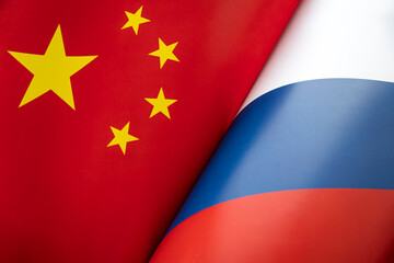 Flags china and Russia. The concept of international relations between countries. Sanctions against Russia. The state of governments. Friendship of peoples.