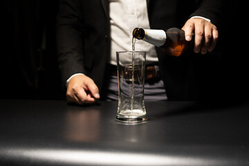 Barman pouring whiskey whiskey glass beautiful night