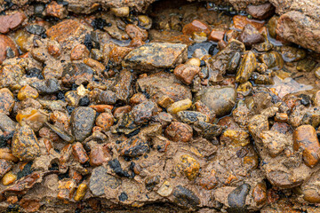 stones in sea weathered concrete