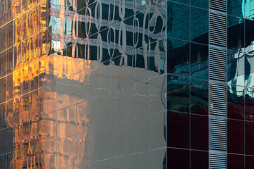 Reflections in a glass facade in downtown Chicago.