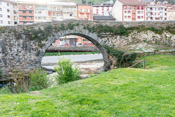 bridge of Roman origin on the Narcea river as it passes through the center of the city of Cangas del Narcea in Asturias, Spain