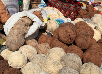 Balls of  sheep and camel wool.  Turkmenistan. Ashkhabad market. - 595476405