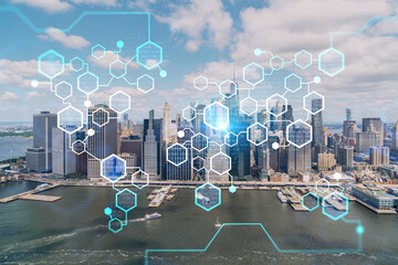 Aerial panoramic helicopter city view on Lower Manhattan district and financial Downtown, New York, USA. Decentralized economy. Blockchain, cryptography and cryptocurrency concept, hologram