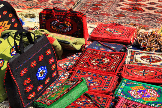 Handmade decorative bags and carpets with traditional ornament. Turkmenistan. Ashkhabad market.