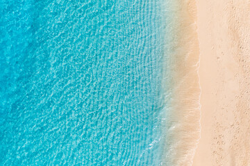 Relaxing aerial beach, vivid summer vacation tropical Mediterranean landscape banner. Waves surf amazing blue ocean lagoon, sea shore coastline. Beautiful aerial drone top view. Peaceful beach seaside