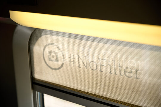 #nofilter sign on a train window curtain in France
