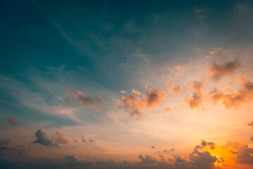 Beautiful sunset sky above clouds with dramatic light. Beautiful sunset sky. Nature sky backgrounds, majestic sunrise sundown sky background with gentle colorful clouds