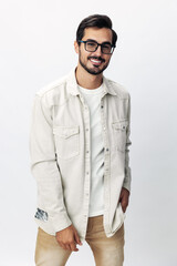 Fototapeta premium Man fashion portrait in glasses smile with teeth joy on a white isolated background, trendy clothing style, copy space, space for text