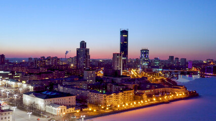 Ekaterinburg, Russia. Night city in the early spring. Dam, Silhouettes of skyscrapers, Aerial View