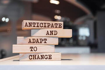 Wooden blocks with words 'Anticipate and adapt to change'. Business concept