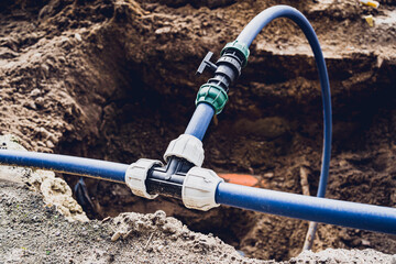Big construction site with pipes and wires in the construction area.
