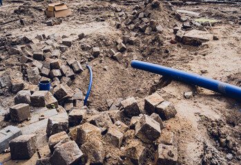 Big construction site with pipes and wires in the construction area.
