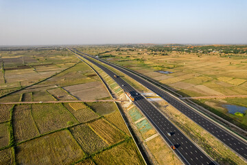 locked tripod aerial drone shot of new delhi mumbai jaipur express elevated highway showing six...