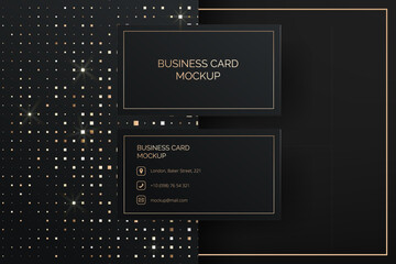 Elegant black and gold vector business card mockup template. The abstract glitter design adds a touch of luxury. Premium mockup for company's identity and contact information for corporate branding