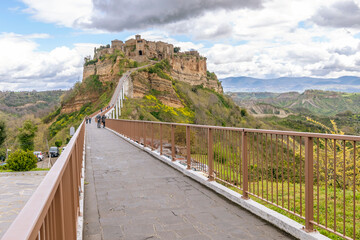 The long steep bridge leading to the dying city, Civita di Bagnoregio, Italy