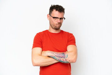 Young caucasian handsome man isolated on white background with unhappy expression
