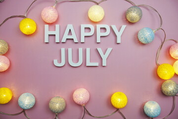 Happy July alphabet letters on pink background