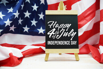Happy Forth of July Independence Day text messege  with USA flag on wooden background