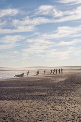 Fishermen Pulling their Net full of fish