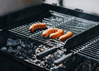 pork sausages on the grill 