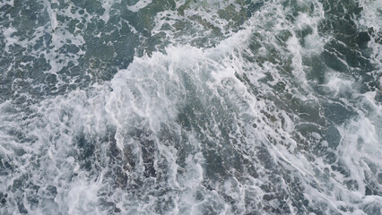 Fototapeta na wymiar Azure waves of mediterranean sea splashing on French Riviera coast